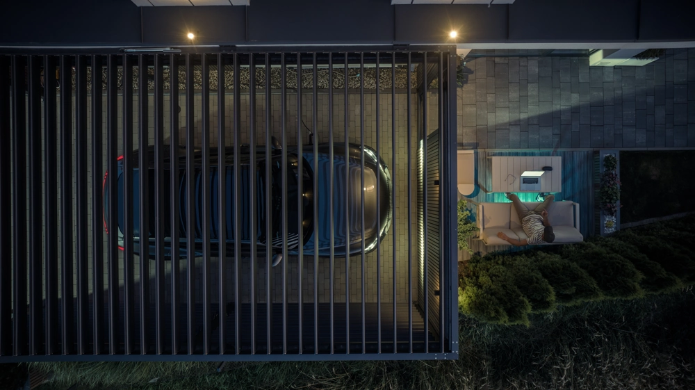 Carport z nowoczesnym zadaszeniem i podjazdem z kostki brukowej obok tarasu z meblami wypoczynkowymi